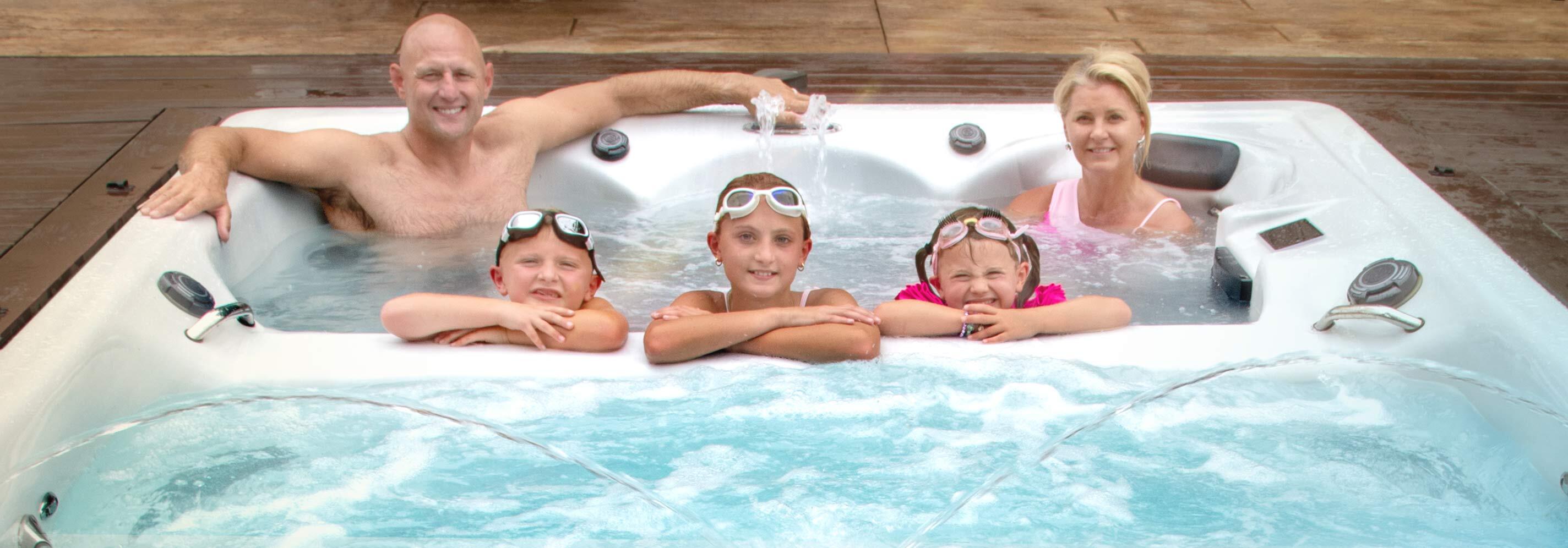 Family in a Master Spas swim spa