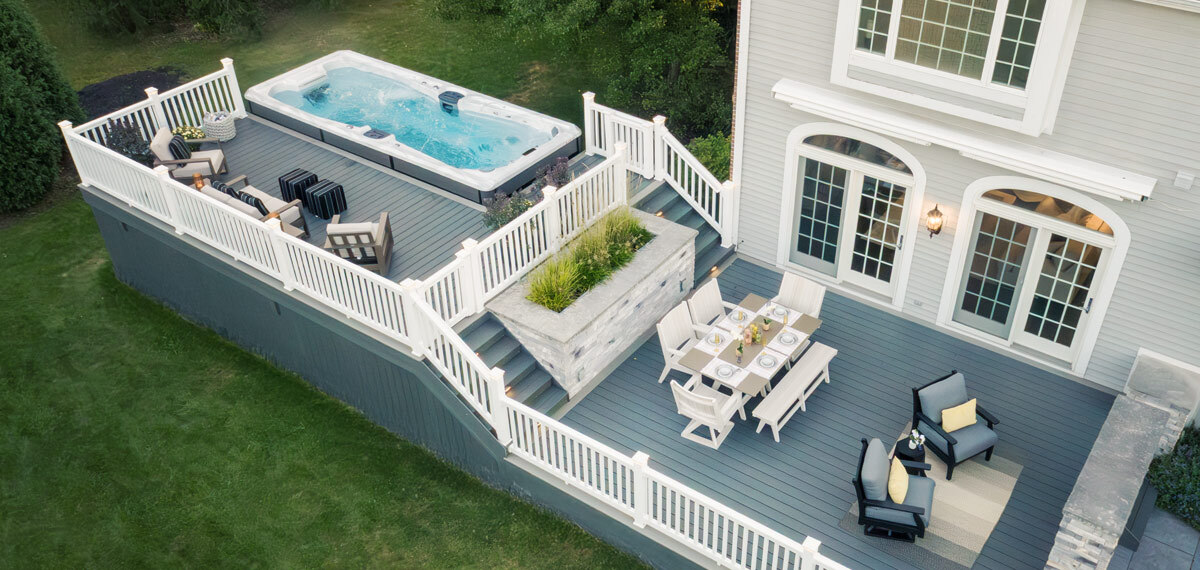 A swim spa in the backyard.