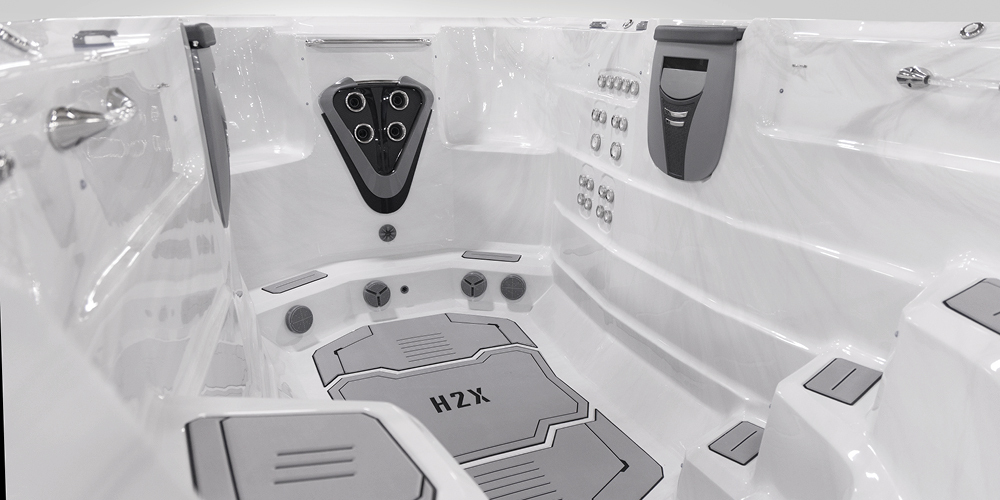 View on the inside of an H2X Fitness swim spa without water focusing on jets.