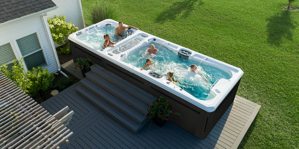 Drone view of a swim spa on a deck.